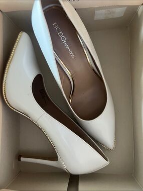 BCBGeneration White Patent Pointed-Toe Stiletto Pumps with Gold Trim